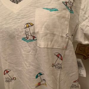 Brand new Frenchie tshirt laying on towel